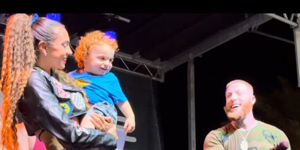Bezz Believe performing on stage with his wife and son, family moment 2025