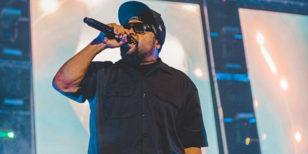 Ice Cube performing live at a hip-hop concert, representing his N.W.A and solo rap legacy