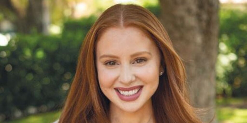 Jackie Oshry smiling warmly, looking approachable and friendly