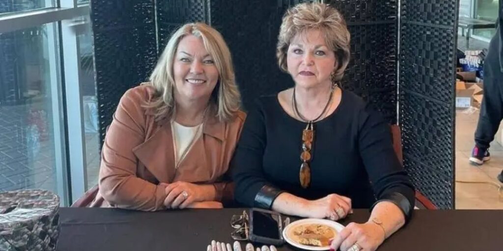 “Kerri Okie with her mother Judy in a simple portrait.”
