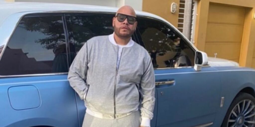 Raul Conde posing with his luxury car in 2025