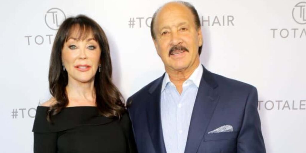 Dr. Sharon McQuillan standing with her husband in a professional and friendly portrait