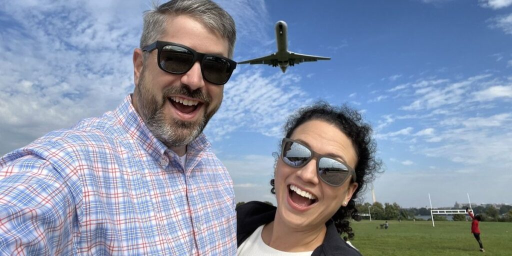Jeb Brooks smiling with his wife Suzanne Brooks during a travel adventure, highlighting his life as a travel YouTuber and entrepreneur
