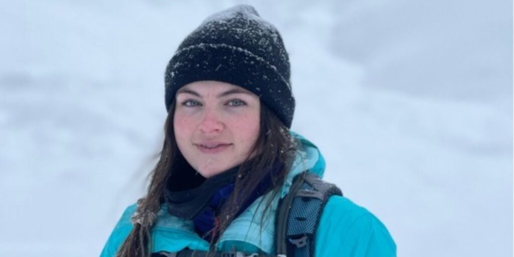 Madison Clysdale hiking in the mountains during her outdoor adventure vlog