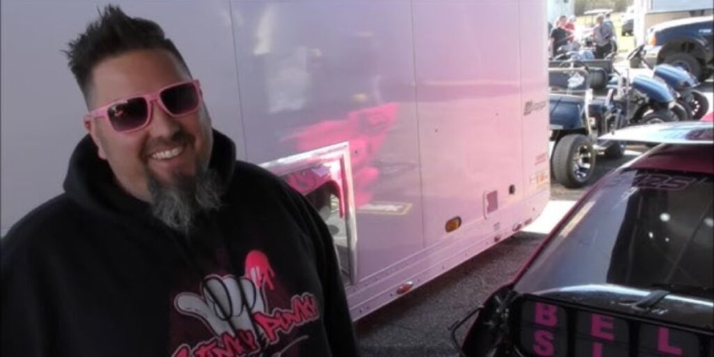 Disco Dean during an interview with his iconic pink race car Stinky Pinky
