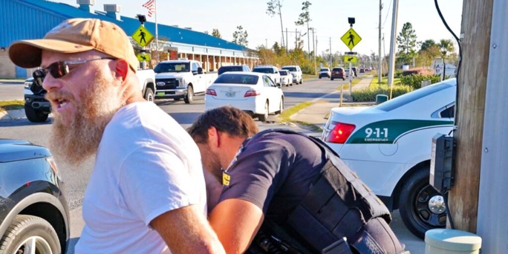 Jason Gutterman being detained by law enforcement during a First Amendment audit in 2021
