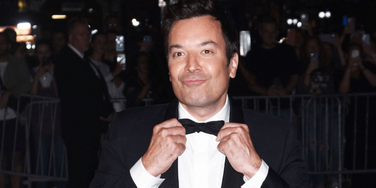 Jimmy Fallon smiling in a studio setting, representing his career and personality in late-night television