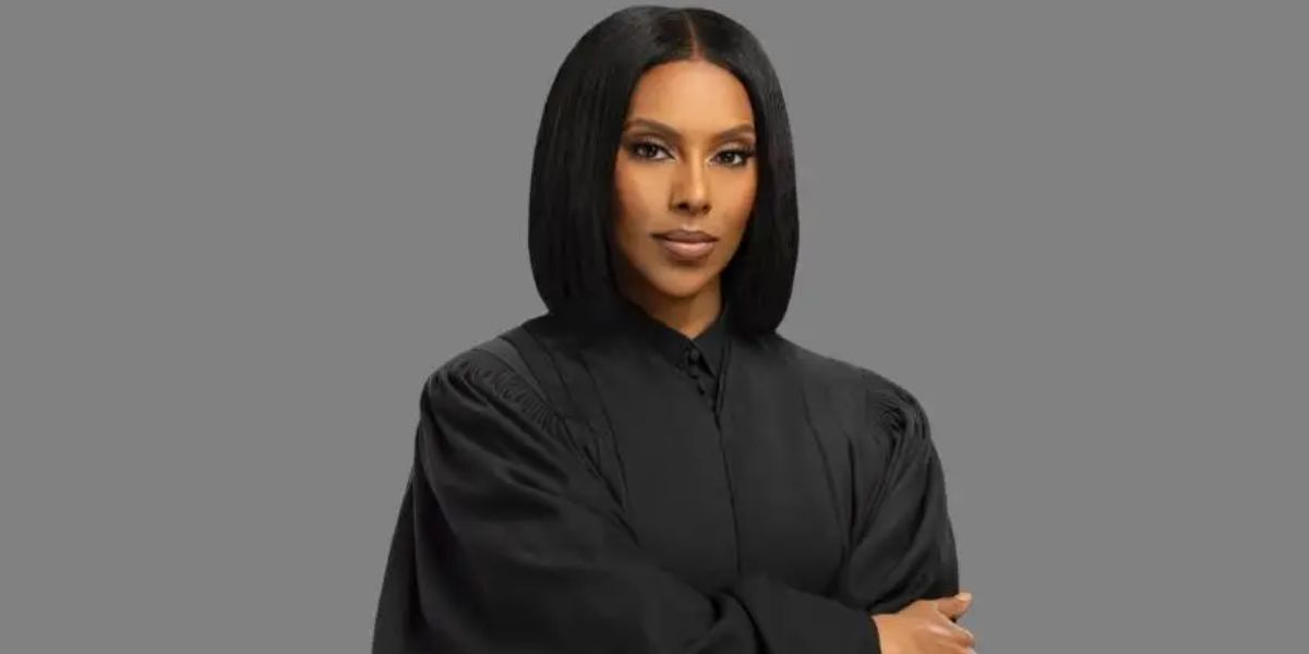 Yodit Tewolde posing in a black dress during a professional portrait shoot