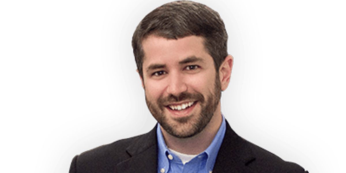 Jeb Brooks smiling during a travel adventure, showcasing his personality as a travel YouTuber, entrepreneur, and author