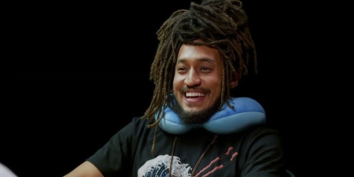 Patrick Cloud smiling, showcasing his charismatic personality and digital creator persona